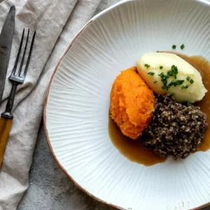 Traditional Scottish haggis paired with self guided tasting of three whisky & gins